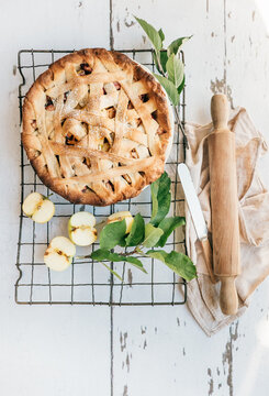 Apple pie cooling on a rack from above.