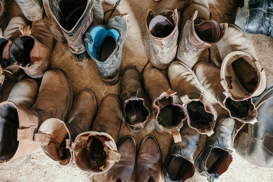 Looking down on a whole lot of riding boots.