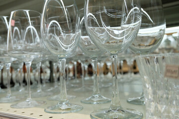 Row of different glass goblets. Barware, close-up