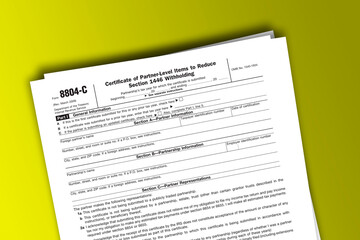 Obraz premium Form 8804-C documentation published IRS USA 07.17.2012. American tax document on colored