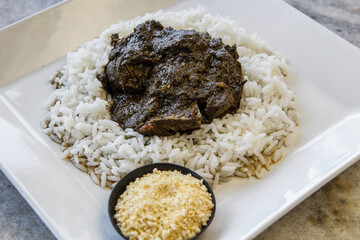 Maniçoba, a festive dish in Brazilian cuisine made with leaves of the Manioc plant. Traditional...