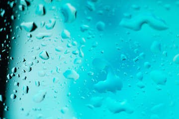 Water drops on glass background. Multi Color gradient texture or abstract background. Blank, template for screensaver.
