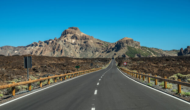  Empty asphalt road in Teide National Park. Tenerife Island.
