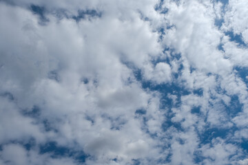 Blue sky background with white clouds. 