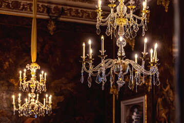 Tiered baroque crystal chandeliers with electric candles