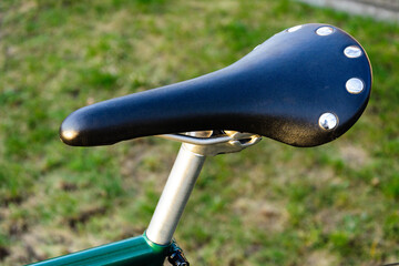 close up saddle and post of fixed gear bike, old vintage bicycle