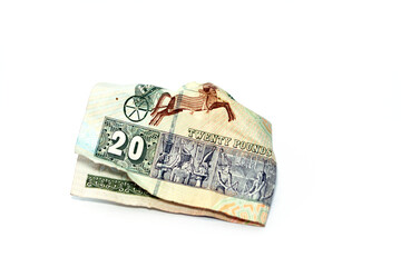 Crumpled Egyptian money of 20 LE twenty pounds isolated on white background, wrinkled 20 pounds...
