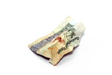 Crumpled Egyptian money of 20 LE twenty pounds isolated on white background, wrinkled 20 pounds...