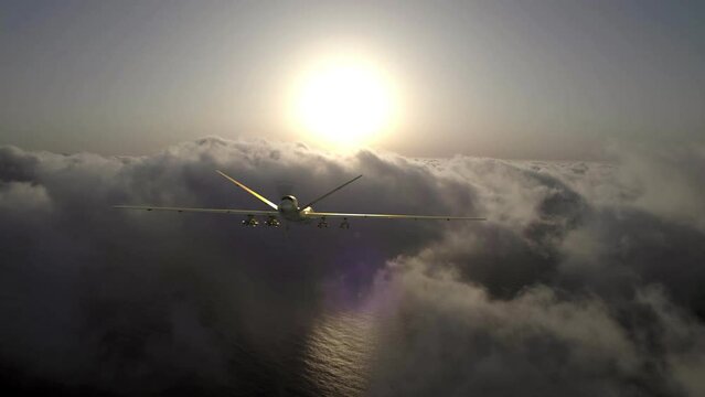 A military drone with full armament flies in the clouds. Sunrise, the beginning of a military mission.