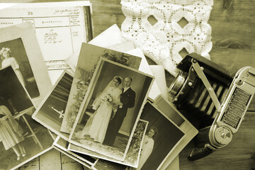 old family photographs, pictures from 1935 in sepia color on wooden table, home archive documents,...