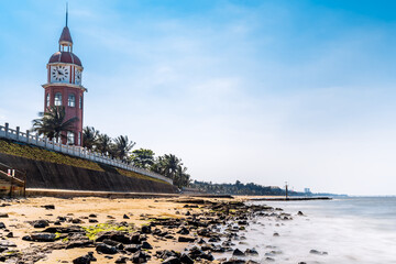 Scenery of clock tower and beach slow gate on west coast of Haikou, Hainan, China
