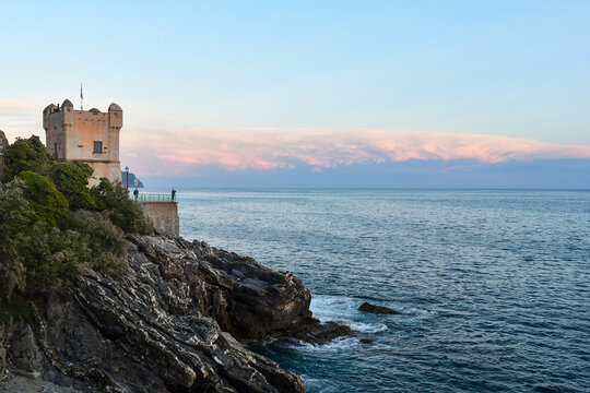 Torre Groppallo, built in the mid-sixteenth century as a defensive construction against attacks by Turkish pirates of Dragut, on the Anita Garibaldi Promenade at sunset, Nervi, Genoa, Liguria, Italy	