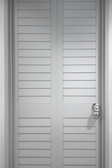 Gray plank door with silver handle. Close-up photo. Entrance door