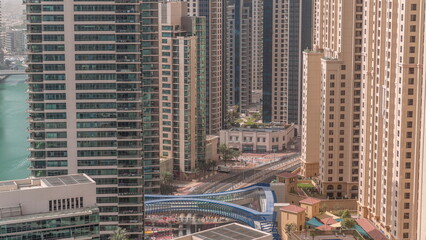 Fototapeta premium Overview to JBR and Dubai Marina skyline with modern high rise skyscrapers waterfront living apartments aerial timelapse