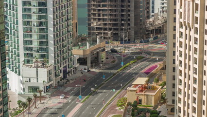 Aerial view of JBR street with heavy traffic timelapse. Dubai road and intersections.