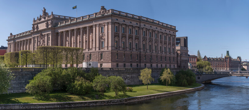 The Swedish Parliament building on the island Helgeandsholmen and the river at Strömgatan a sunny day in Stockholm