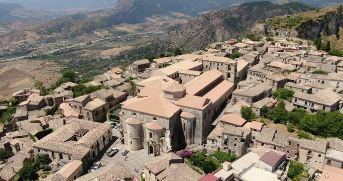 Gerace, Calabria, Italy. Aerial drone view. Slow turning flight around the abbey.