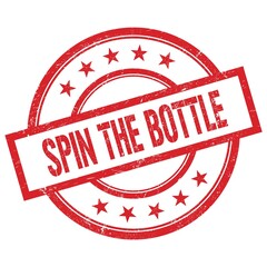 SPIN THE BOTTLE text written on red vintage round stamp.