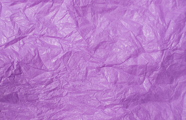 Naklejka premium The texture of crumpled pink paper. Paper for wrapping gifts and flowers. Abstract background made of tishyu paper.