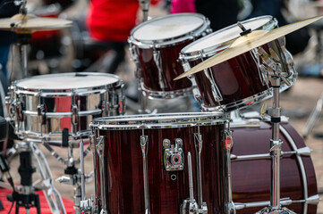 A set of plates in a drum set. At a concert of percussion music, selective focus, closeup