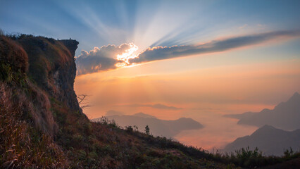 Sunrise at Phu chi fa with foggy morning , Phu chi fa, Chang Rai, Thailand - obrazy, fototapety, plakaty