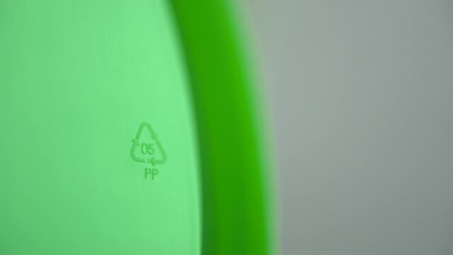 4k Closeup view of PP 05 recycling sign or label on green packaging spbd. PP polypropylene has high melting point, so it's often chosen for containers that will hold hot liquid. It's gradually