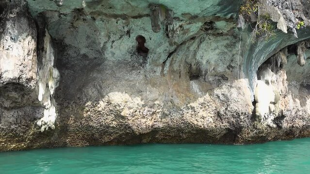 Close up video of eroded rocky cliff in sea, Thailand