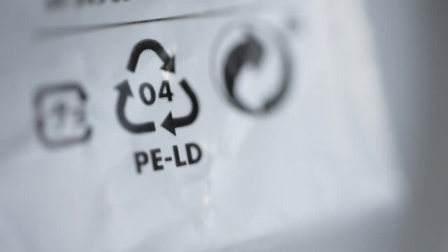 4k Close view of 4 LDPE recycling sign or label and others on white packaging spbd. Low density polyethylene is flexible plastic with many applications. Found in: squeezable bottles, bread, frozen