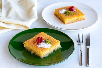 Kadayif dessert with pistachio on a white background. Traditional Turkish cuisine delicacies. close up