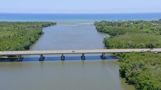 Bridge crossing the Soco river close to the river mouth, aerial fly over