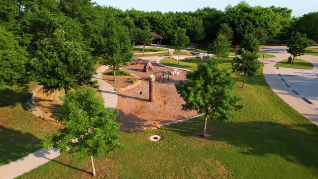 Aerial footage of Post Oak Park in Flowermound Texas.vDrone approaches playground.