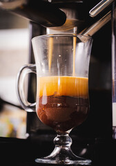 
Coffee being extracted in the machine