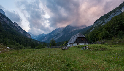 Fototapeta na wymiar Old cottages in the mountains of the Julian Alps