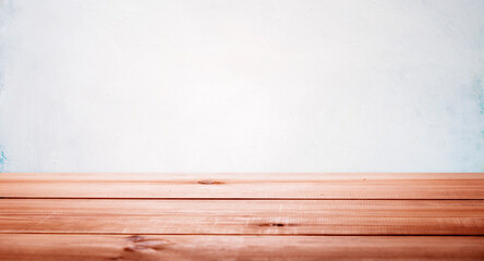 Wood table and white empty wall in home interior for product placement stand. Floor desk display mockup. Room shelf, kitchen board counter background.