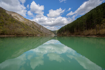 A series of cruises on the Drina River. The mirror of the emerald waters. Symmetry.