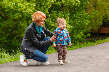 beautiful girl with a boy in the park on the background of the lake in the park