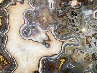 Polished onyx marble surfaces quartzite structure slice mineral macro closeup.