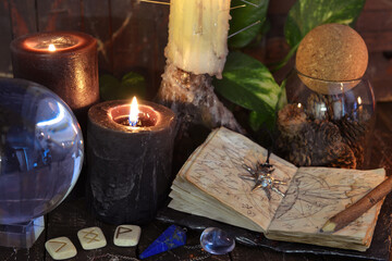 Wicca, esoteric and occult still life with vintage magic objects on witch table altar for mystic...