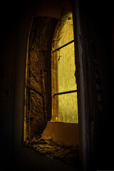 abandoned church with yellows sained glass windows