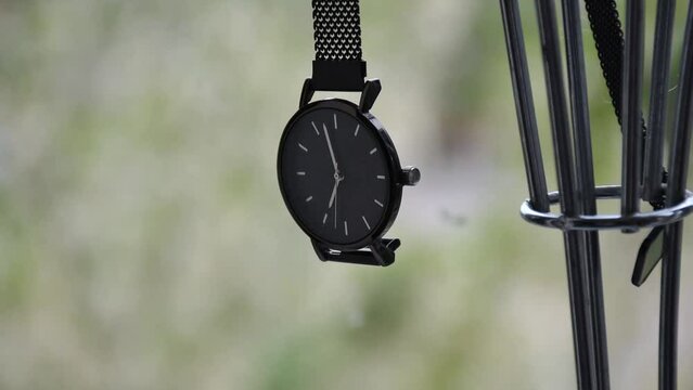 Elegant wrist watch. Close-up on a blurred background.