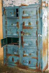 Old green metal mailbox cabinet