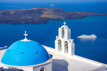 view of Fira, caldera, volcano of Santorini, Greece with cruise ships