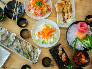 Top view of big meal with assorted and various sushi, sashimi japanese food.