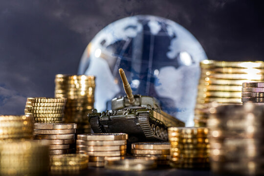 Stacks of money and a tank in front of a globe symbolizing global armament and finance