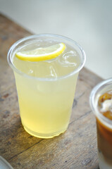 lime juice or lemon juice, lemon soda or tonic or soda and lime slice topping