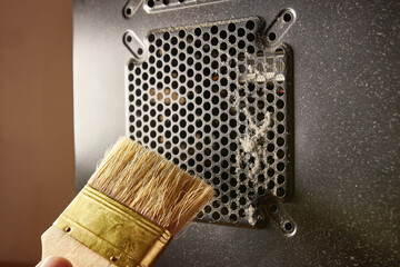 Dust contamination of the computer case grille. PC care and cleaning.