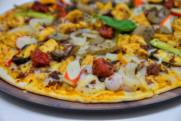 Chicken sausage and seafood pizza. isolated on a white background