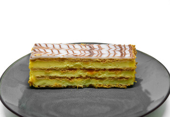 french mille-feuille cake closeup on white background. - obrazy, fototapety, plakaty