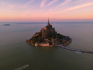 Aerial view of famous Le Mont-Saint-Michel at sunset in Normandie, France