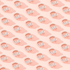 abstract background with wireless audio headphones on pink.